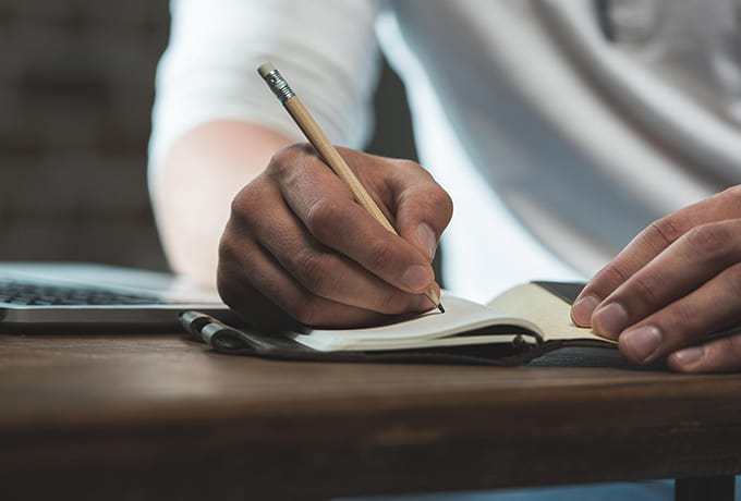 Man writing a suicide safety plan