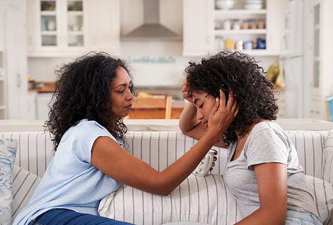 Supporting adolescents: Mother comforting her daughter bereaved by suicide