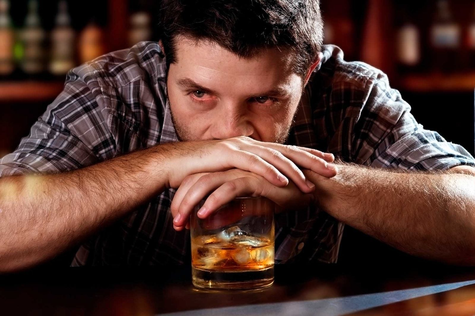 Depressed man drinking alcohol